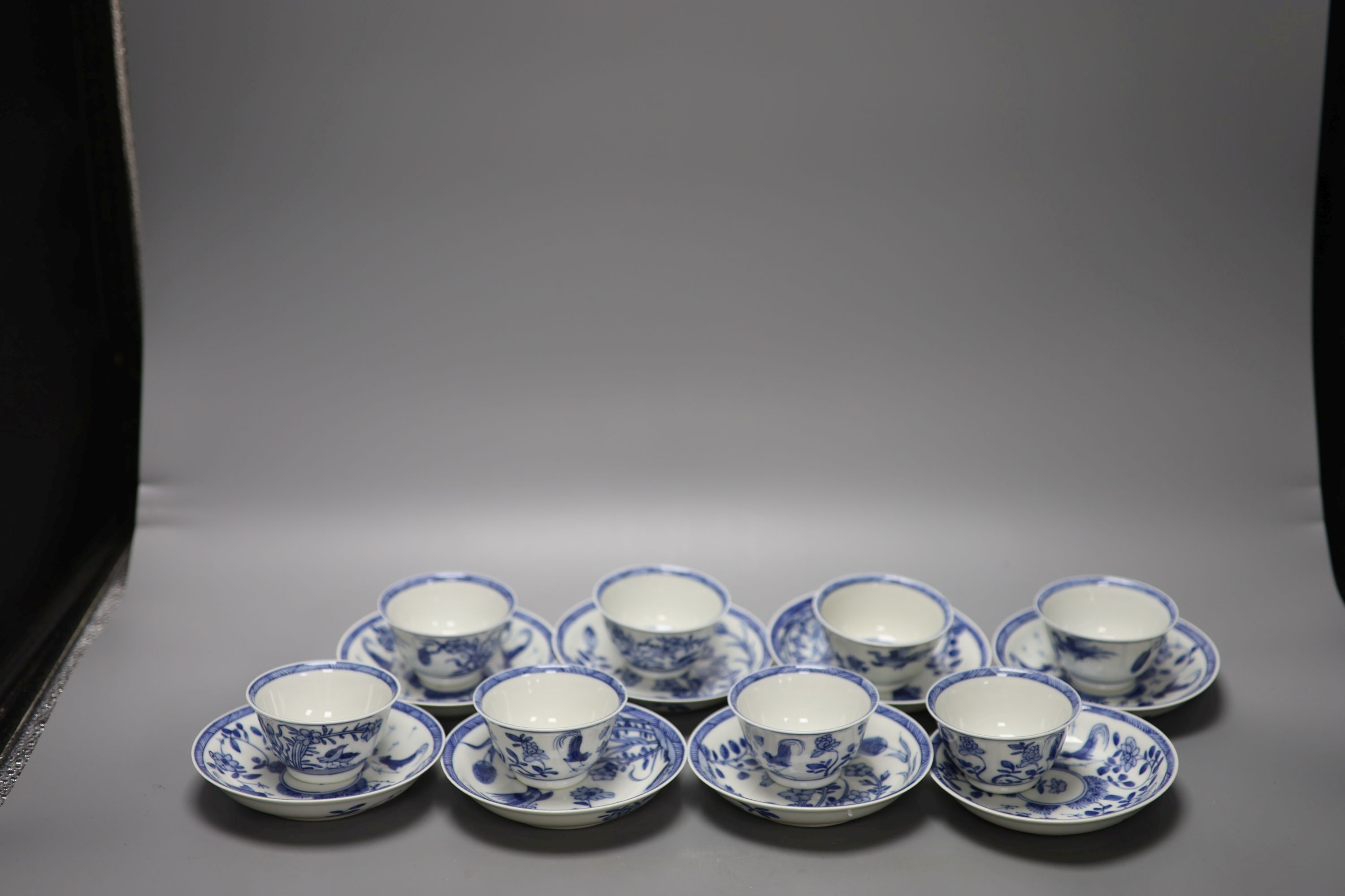 Five Chinese blue and white 'birds' tea bowls and four saucers and three 'chicken' tea bowls and four saucers (16)